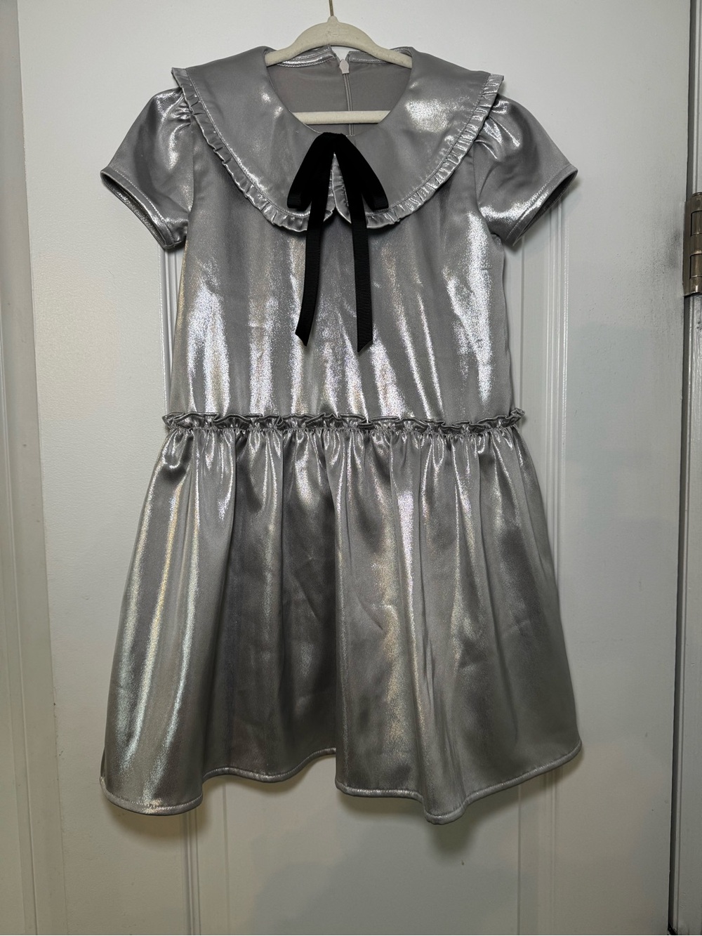 Girl’s Silver Metallic Dress with Black Bow